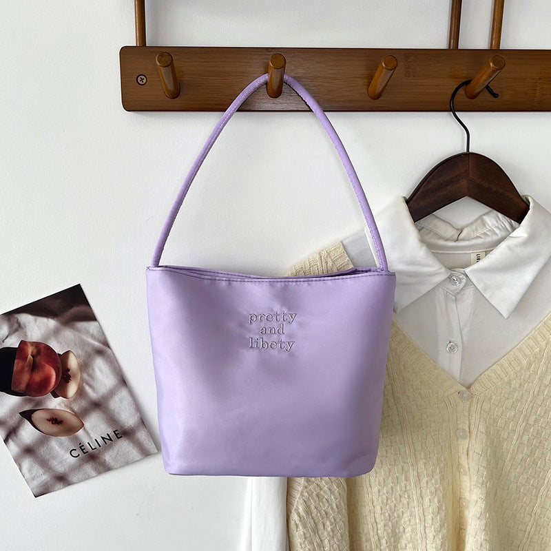 Embroidered letter fashionable handbag