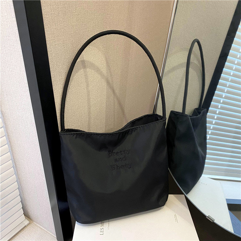 Embroidered letter fashionable handbag