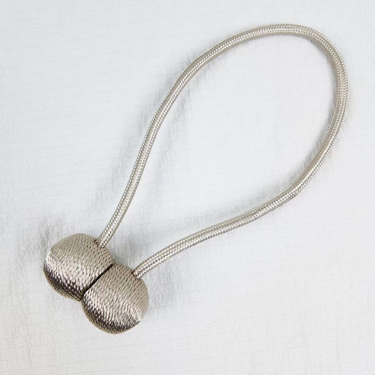 Magnetic curtain drawstring